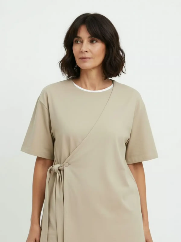 Professional uniform set featuring a modern wrap-style top with side tie detail.