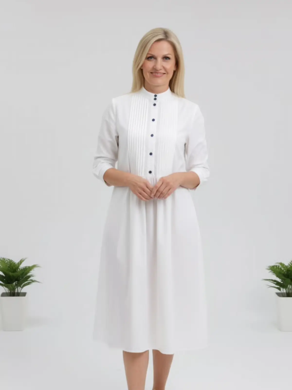 A breezy, elegant shirt-dress designed for effortless summer comfort.