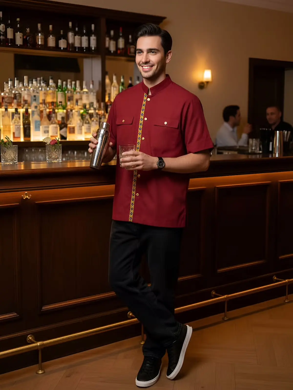 Short-sleeve barista shirt in deep burgundy, featuring a decorative vertical trim on the front.