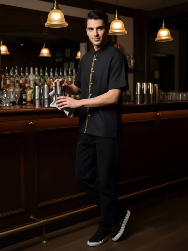 Short-sleeve barista shirt in black, featuring a decorative vertical golden trim on the front.