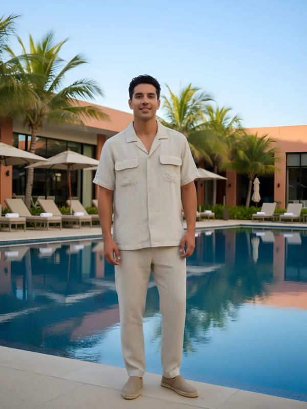 Lightweight two-piece set in a natural ecru shade, featuring a relaxed short-sleeved shirt and straight-leg trousers.